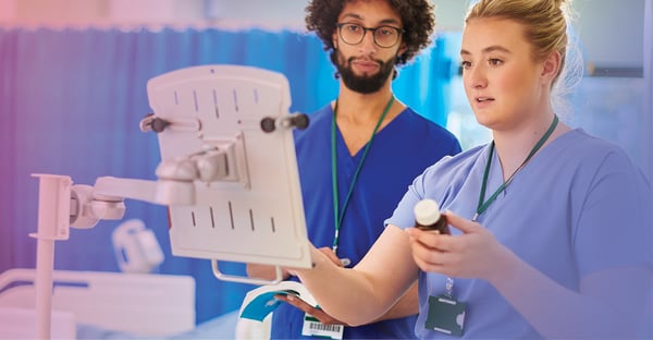 Clinicians using a computer Clinicians using a computer